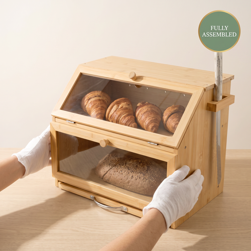 Fully assembled 3-in-1 bamboo bread bin being placed on a worktop, ready to use